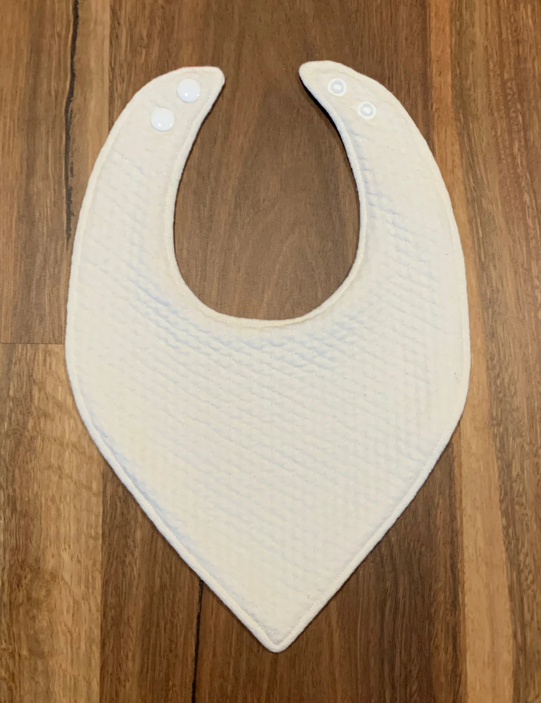 White backing on dribble bib