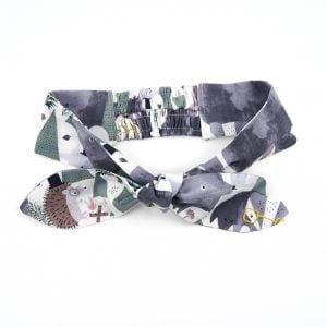 Headband tied in bow with soft stretch back in the woodland animals pattern