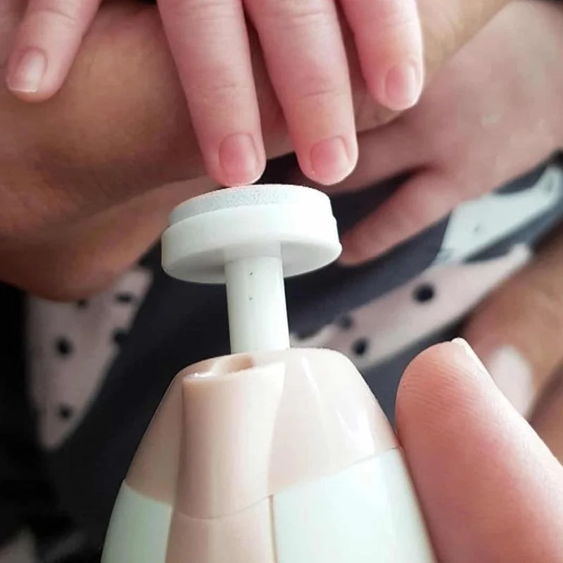 Child nails being done with Haakaa nail care set close up