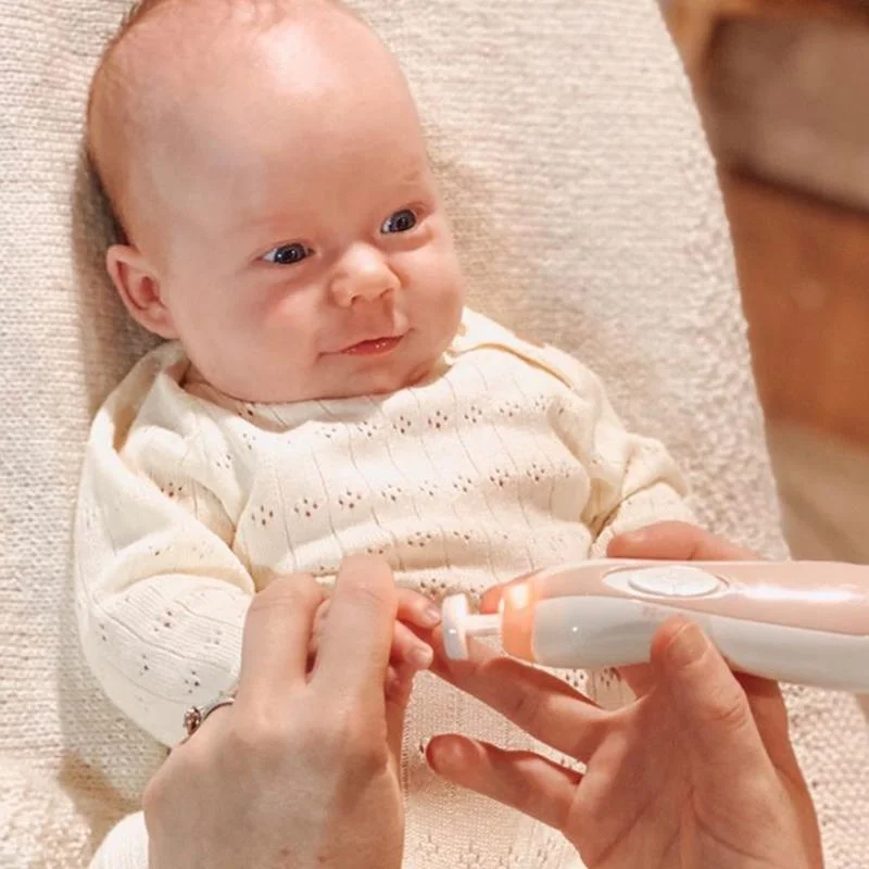 Child nails being done with Haakaa nail care set