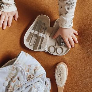 Baby crawling over Pear-fect Manicure Kit