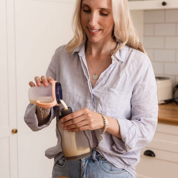 Haakaa silicone milk storage bag being filled