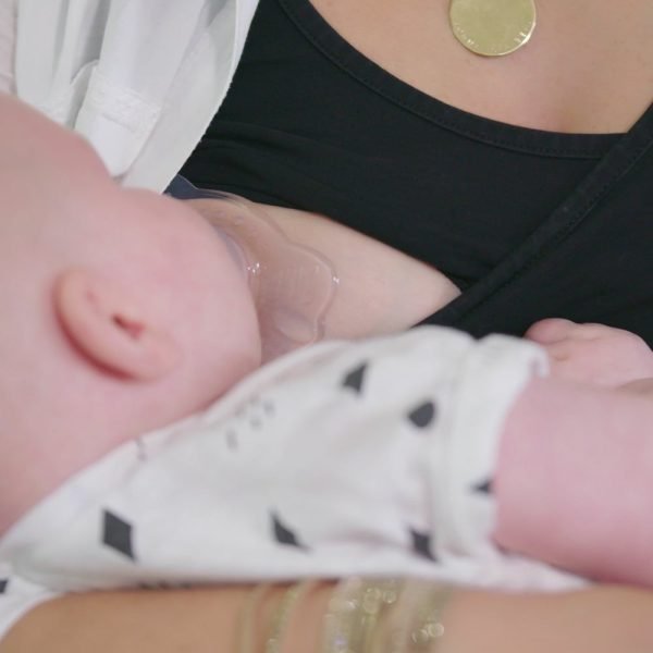 Breastfeeding nipple shield in use